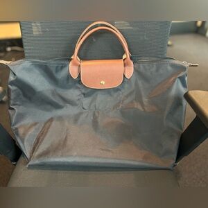 Longchamp Black and Brown Overnight Bag.
